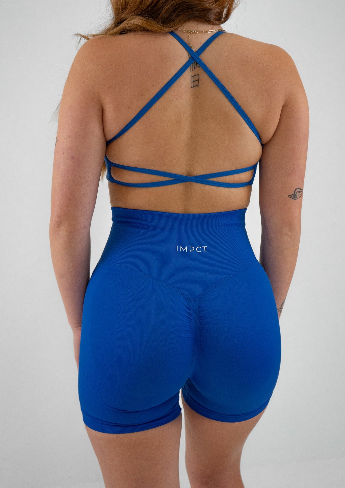 Model wearing blue activewear set