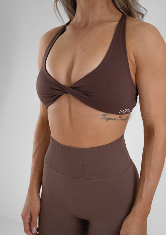 Model wearing a brown activewear set