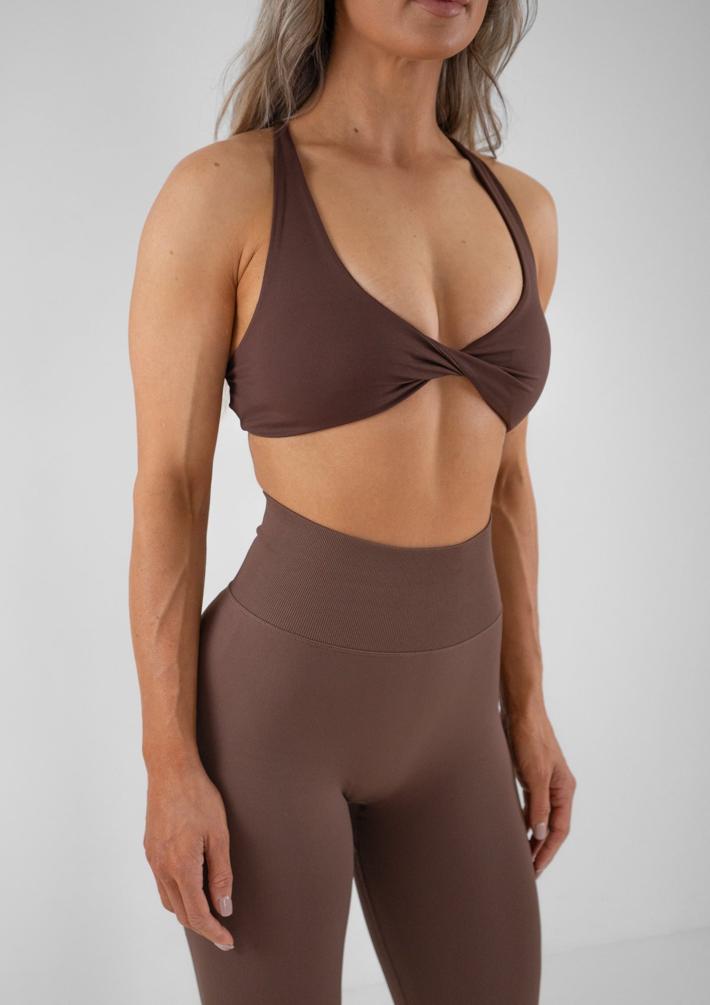 Model wearing a brown activewear set