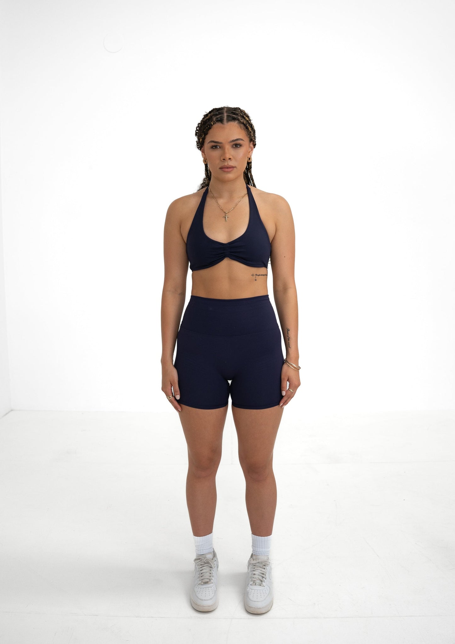 Model wearing a navy blue activewear set