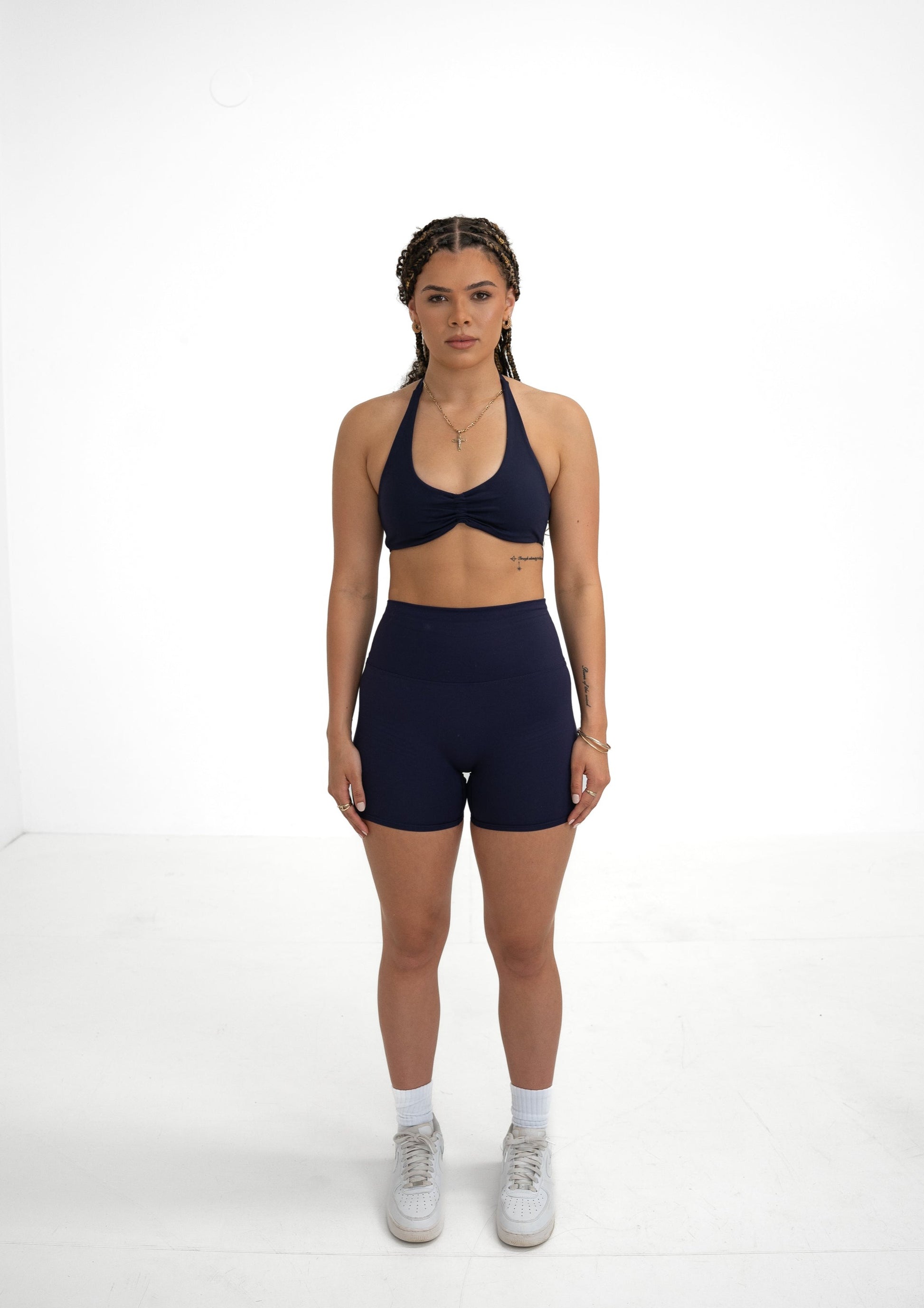 Model wearing a navy blue activewear set