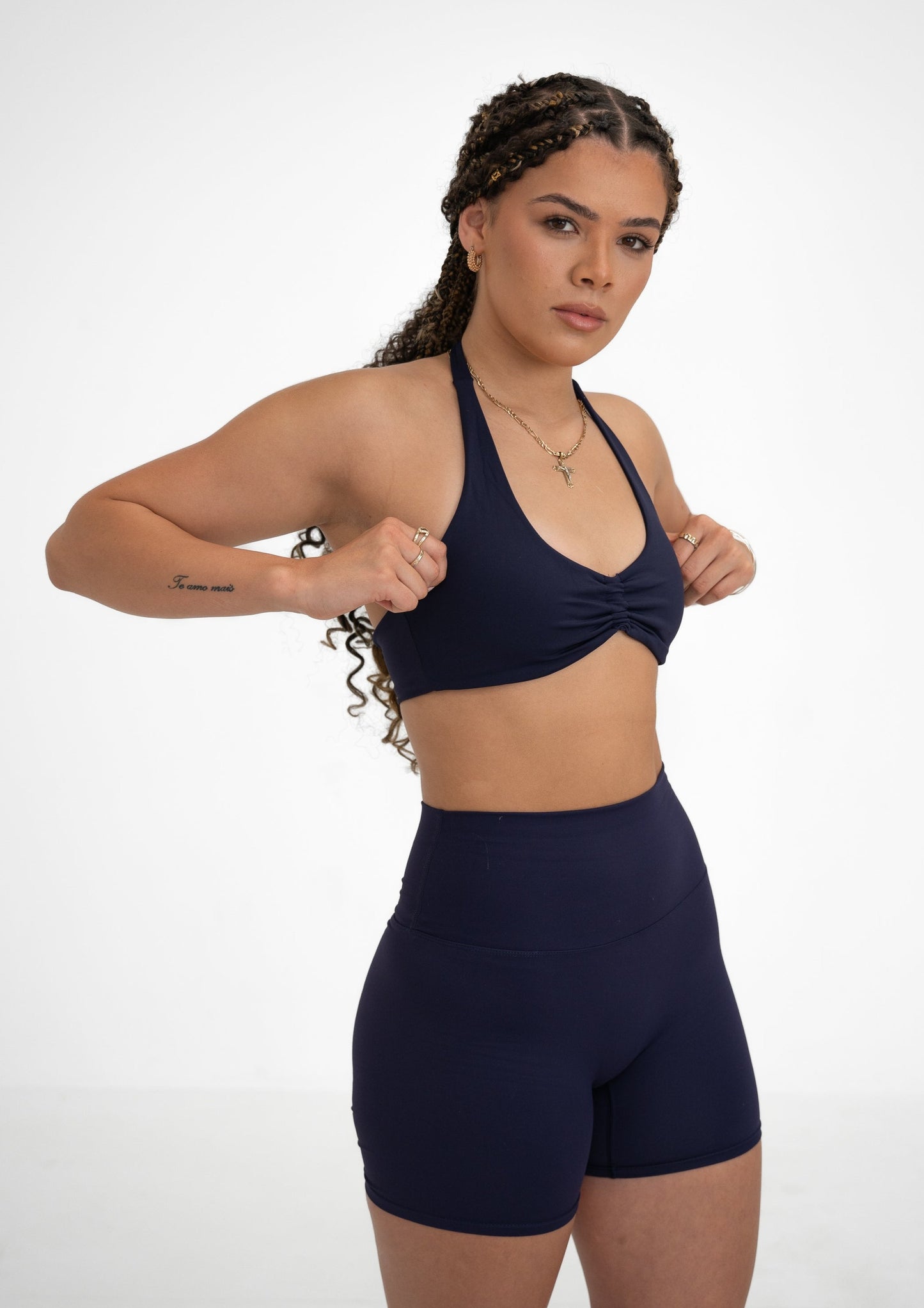 Model wearing a navy blue activewear set