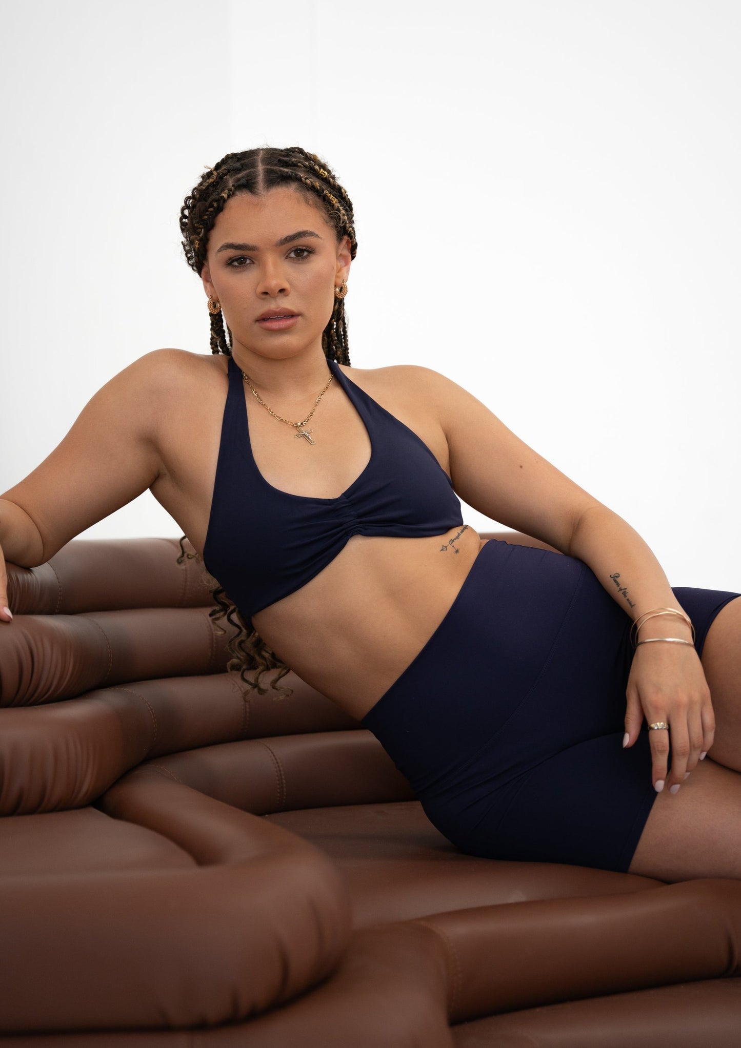 Model wearing a navy blue activewear set